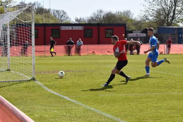 Gary Austin scores one of his four first half goals for Fareham against  Amesbury. Picture: Paul Proctor.