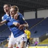 Harvey White celebrates his goal at Oxford with Ronan Curtis. Picture: Jason Brown