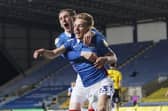 Harvey White celebrates his goal at Oxford with Ronan Curtis. Picture: Jason Brown