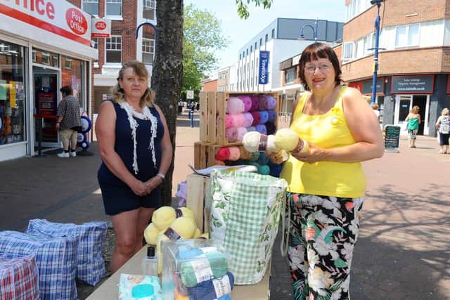 Gosport Market reopened in the High Street on Tuesday, June 2.
Pictured is: (l-r) Nikki Eastland from Giddy Goat Yarns and Accessories serving Tandy Powell.
Picture: Sarah Standing (020620-9443)