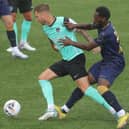 Ben Stevenson holds off Roarie Deacon in Saturday's friendly against the Hawks. Picture: Dave Haines