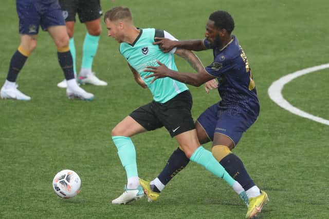 Ben Stevenson holds off Roarie Deacon in Saturday's friendly against the Hawks. Picture: Dave Haines