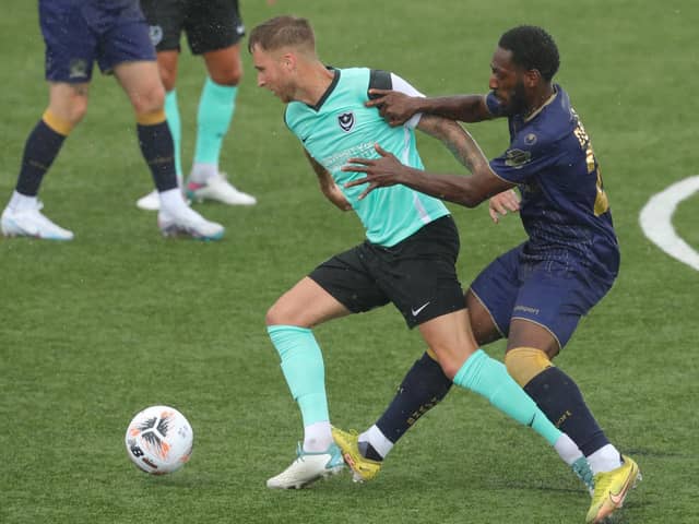 Ben Stevenson holds off Roarie Deacon in Saturday's friendly against the Hawks. Picture: Dave Haines