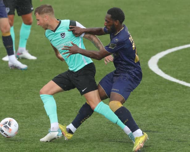 Ben Stevenson holds off Roarie Deacon in Saturday's friendly against the Hawks. Picture: Dave Haines