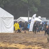 Revalers finally enter the main field to be met with very muddy conditions. Picture: Andy Hornby