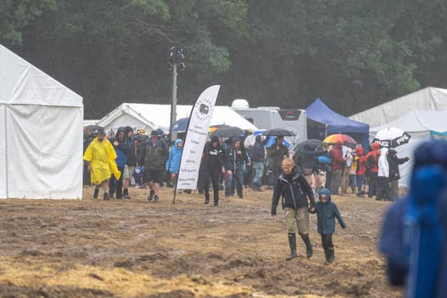 Revalers finally enter the main field to be met with very muddy conditions. Picture: Andy Hornby