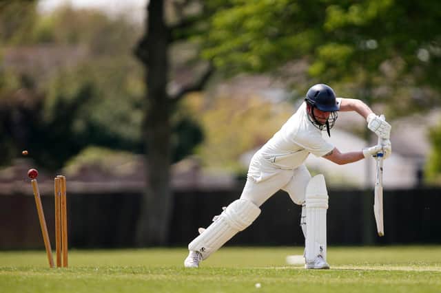 Portsmouth Community's Matt Davies is bowled during his side's win over Hayling Island. Picture: Chris Moorhouse