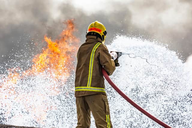 Firefighters have lashed out after being sent on a hoax call. Pictured: A firefighter battling a blaze.