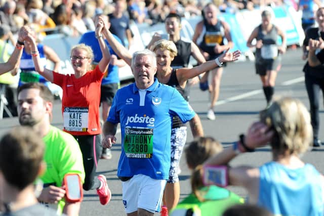 'Touchline' Tony Male crosses the finish line in the Great South Run 2018. Picture: Sarah Standing (180800-7721)