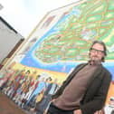 Artist Mark Lewis pictured in front of the Strand mural on the junction of Waverley Road and Clarendon Road in Southsea.

Picture: Sarah Standing (171120-8684)