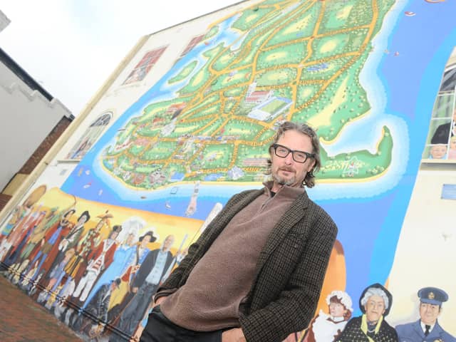 Artist Mark Lewis pictured in front of the Strand mural on the junction of Waverley Road and Clarendon Road in Southsea.

Picture: Sarah Standing (171120-8684)