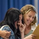 Tears from Phoebe Marshall as she finds that she passed all her exams and gained a grade 8 in English literature. Pictured with Mrs Robertson. Picture: Mike Cooter (240823)