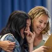Tears from Phoebe Marshall as she finds that she passed all her exams and gained a grade 8 in English literature. Pictured with Mrs Robertson. Picture: Mike Cooter (240823)