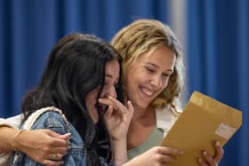Tears from Phoebe Marshall as she finds that she passed all her exams and gained a grade 8 in English literature. Pictured with Mrs Robertson. Picture: Mike Cooter (240823)