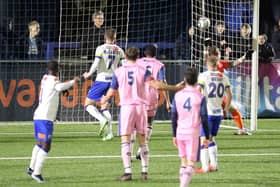 Abdulai Baggie, left, watches his header fly over Dulwich keeper Charlie Grainger. Picture: Dave Haines