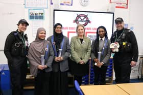Pupils from the Safe Edge app team with Donna Jones and police constables.
