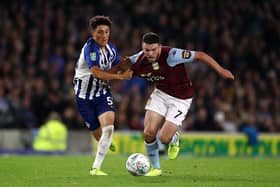 Brighton's Haydon Roberts battles with Aston Villa's John McGinn. (Photo by Bryn Lennon/Getty Images)