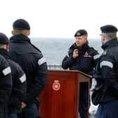 Commander George Storton reminds HMS Dragon's sailors of HMS Ark Royals achievements and sacrifices