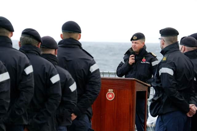 Commander George Storton reminds HMS Dragon's sailors of HMS Ark Royals achievements and sacrifices