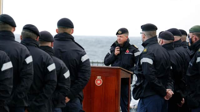 Commander George Storton reminds HMS Dragon's sailors of HMS Ark Royals achievements and sacrifices