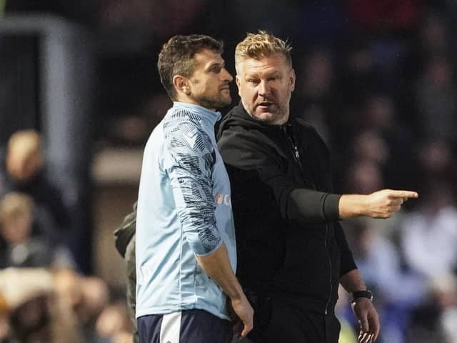 Oxford United boss Karl Robinson has branded Sam Purkiss' officiating an 'embarrassment' against Pompey.