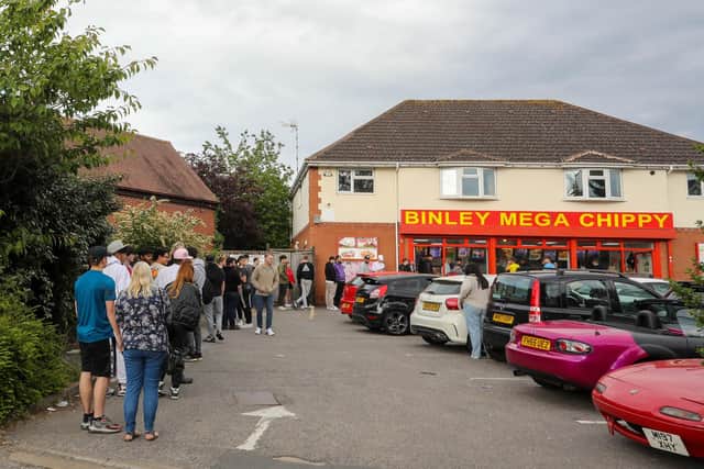 Customers queuing outside Binley Mega Chippy in Coventry. Picture: SWNS