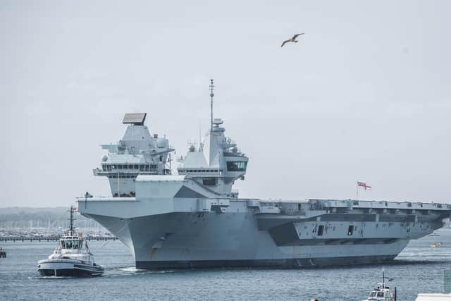 HMS Queen Elizabeth departs from Portsmouth after ship's crew is tested for Covid-19 
on Wednesday 29 April 2020.

Pictured: HMS Queen Elizabeth passes the Round Tower, Old Portsmouth  .

Picture: Habibur Rahman