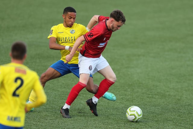 Camberley's Macauley Martin and Hawks' Leon Baker, right. Picture by Dave Haines.