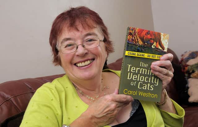 Carol Westron with her first novel, The Terminal Velocity of Cats
Picture: Mick Young