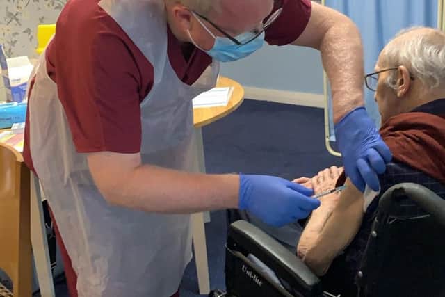 Bob receiving his first Covid jab