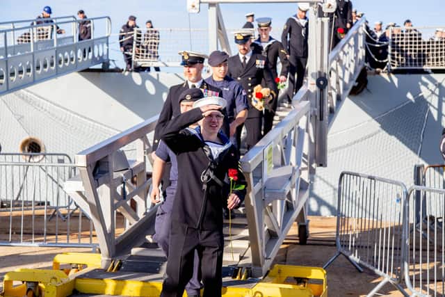 HMS Defender and HMS Diamond return to Portsmouth from the global UK Carrier Strike Group deployment on Thursday 9th December 2021
Pictured:Crew members stepping off HMS Diamond.
Picture: Habibur Rahman