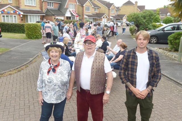 Residents in Magpie Close, Fareham, held a street party on Sunday, June 5, to celebrate The Queen's Platinum Jubilee.
Pictured is: (middle) Stuart Reed (81) with his wife Irene Reed (79) and grandson Mitchell Rock (27).
Picture: Sarah Standing (050622-9604)