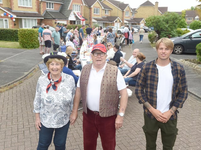 Residents in Magpie Close, Fareham, held a street party on Sunday, June 5, to celebrate The Queen's Platinum Jubilee.
Pictured is: (middle) Stuart Reed (81) with his wife Irene Reed (79) and grandson Mitchell Rock (27).
Picture: Sarah Standing (050622-9604)