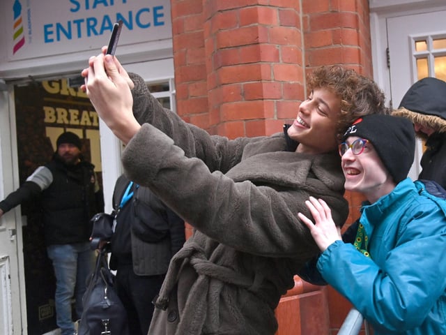 Bobby Brazier takes a selfie with a fan.