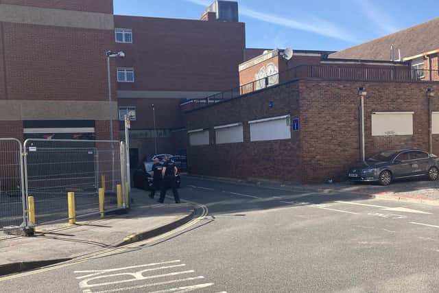 Police investigate as objects thrown off abandoned Debenhams store in Commercial Road on April 17. Pic Steve Deeks