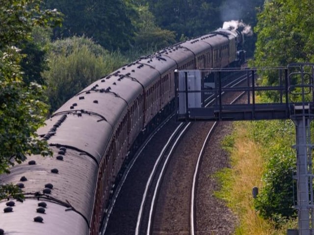 The Flying Scotsman pulling the Portsmouth Flyer service passes through Cosham
