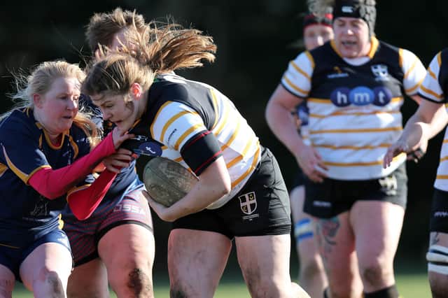 Natasha Davison is tackled by an Ellingham & Ringwood opponent. Picture: Chris Moorhouse