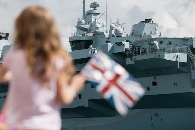Crowds watch HMS Queen Elizabeth arriving home. Photo: Royal Navy