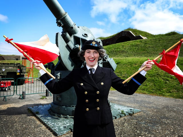 Kate Harriss is dressed as a member of the WRNS. Ms Harriss is a member of HistoryRiot, a historical interpretation company.