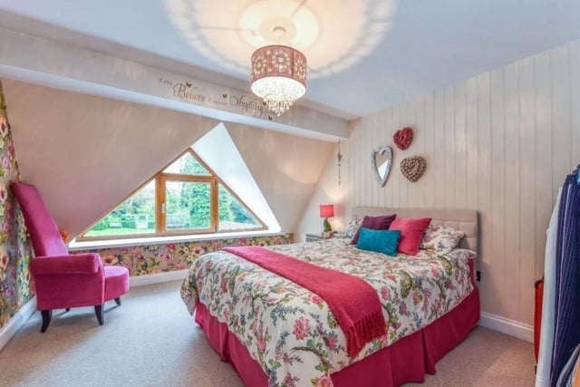 The listing says that this house 'offers deceptively spacious accommodation comprising of five bedrooms, three with en-suite shower rooms, family bathroom, four reception rooms and a feature fitted kitchen/breakfast room.' The listing says: "Approached over a generous gravelled driveway allowing parking for several vehicles and steps up to a front veranda and front door into the central hallway which immediately reflects the immaculate presentation offered." This property is on the market with Homes Estate Agents Ltd and it is up for £1,250,000. For more information about the property, visit the property. This home is near local schools including Woodcroft Primary and Horndean Technology College.