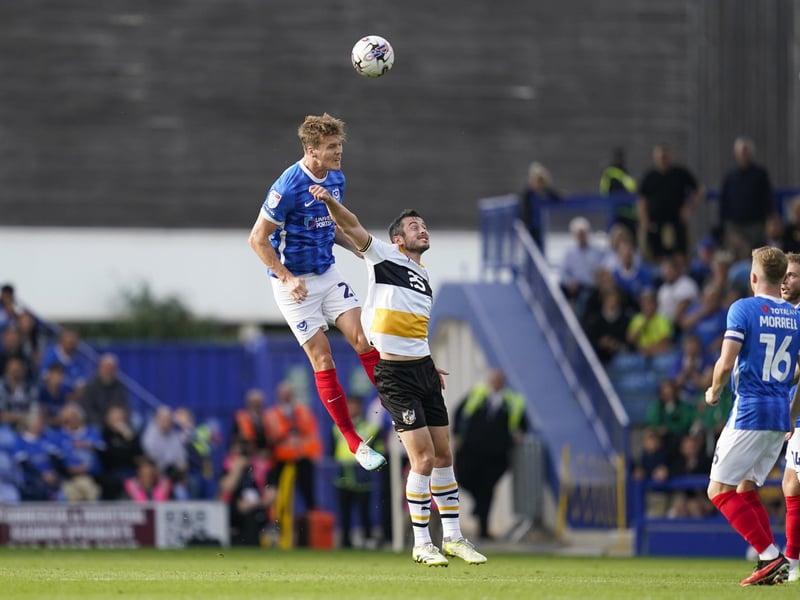 Sean Raggett soars to head clear on his Pompey first-team return against Port Vale. Picture: Jason Brown/ProSportsImages