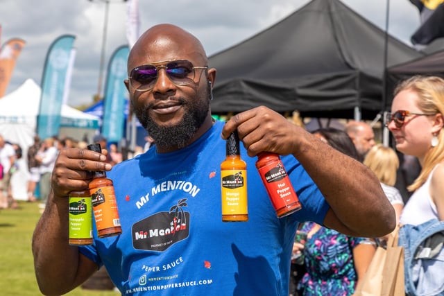 Odafe shows of the products from Tickenham based Mr Mentions Hot Sauce. Picture: Mike Cooter (210522)