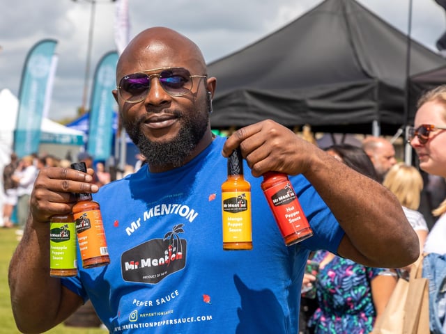 Odafe shows of the products from Tickenham based Mr Mentions Hot Sauce. Picture: Mike Cooter (210522)