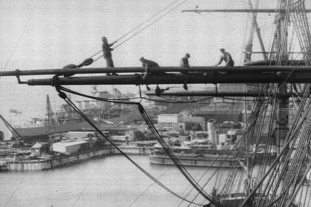 20th April 1934:  Riggers at work on Nelson's flagship, HMS Victory in Portsmouth dockyard. She is re-rigged every five years and will be ready in time for Navy Week when thousands of visitors will look round her.  (Photo by R. Wesley/Fox Photos/Getty Images)