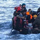 Asylum seekers in a dinghy as they cross the English Channel from France to Britain on 15 March, 2022. Credit: Sameer Al-DOUMY / AFP via Getty Images