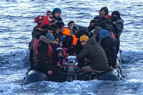 Asylum seekers in a dinghy as they cross the English Channel from France to Britain on 15 March, 2022. Credit: Sameer Al-DOUMY / AFP via Getty Images