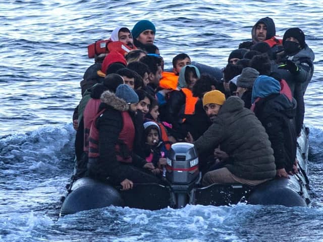 Asylum seekers in a dinghy as they cross the English Channel from France to Britain on 15 March, 2022. Credit: Sameer Al-DOUMY / AFP via Getty Images