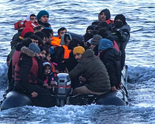 Asylum seekers in a dinghy as they cross the English Channel from France to Britain on 15 March, 2022. Credit: Sameer Al-DOUMY / AFP via Getty Images