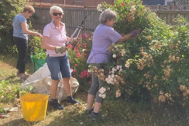 Helping with gardening in the homes that are being provided to those who were formerly homeless