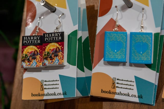 Miniature book earrings by BookOnAHook at the Gosport Christmas market. Picture: Mike Cooter (251123)